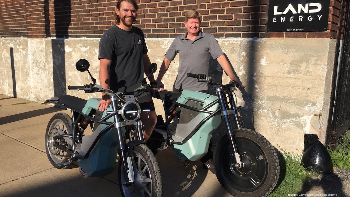 BRITE startup founder Scott Colosimo standing with two LAND e-bikes