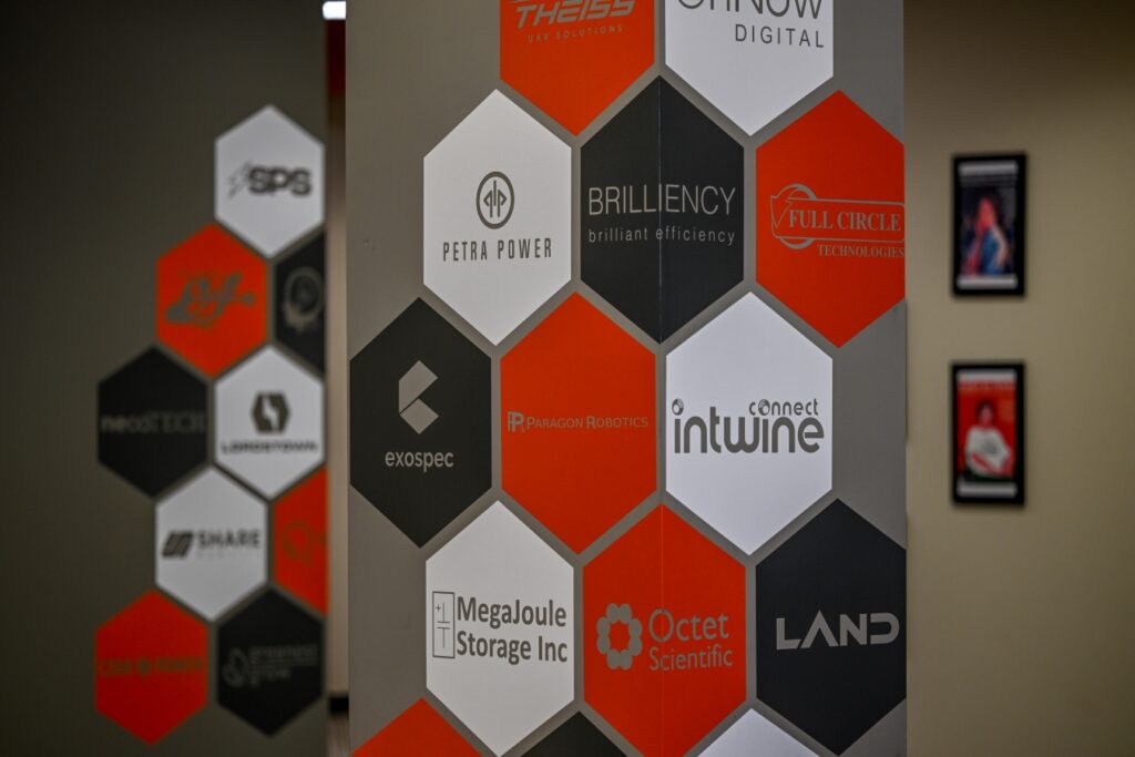 Hexagon wall decor at BRITE showing BRITE member logos